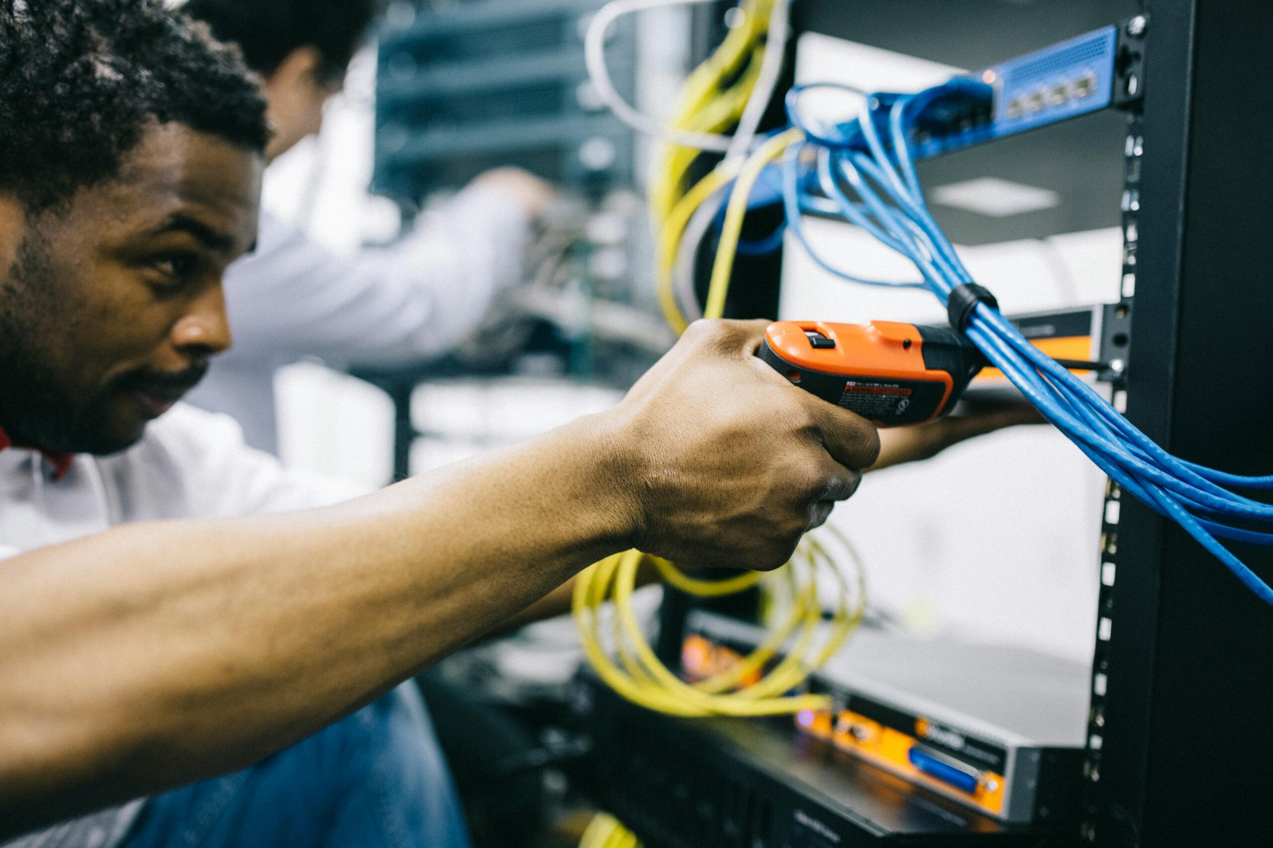 technical support personnel stacking servers